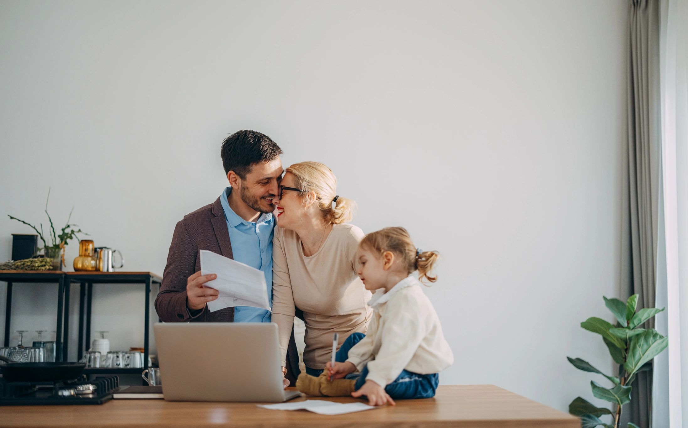 Family reviewing finances together for loan planning